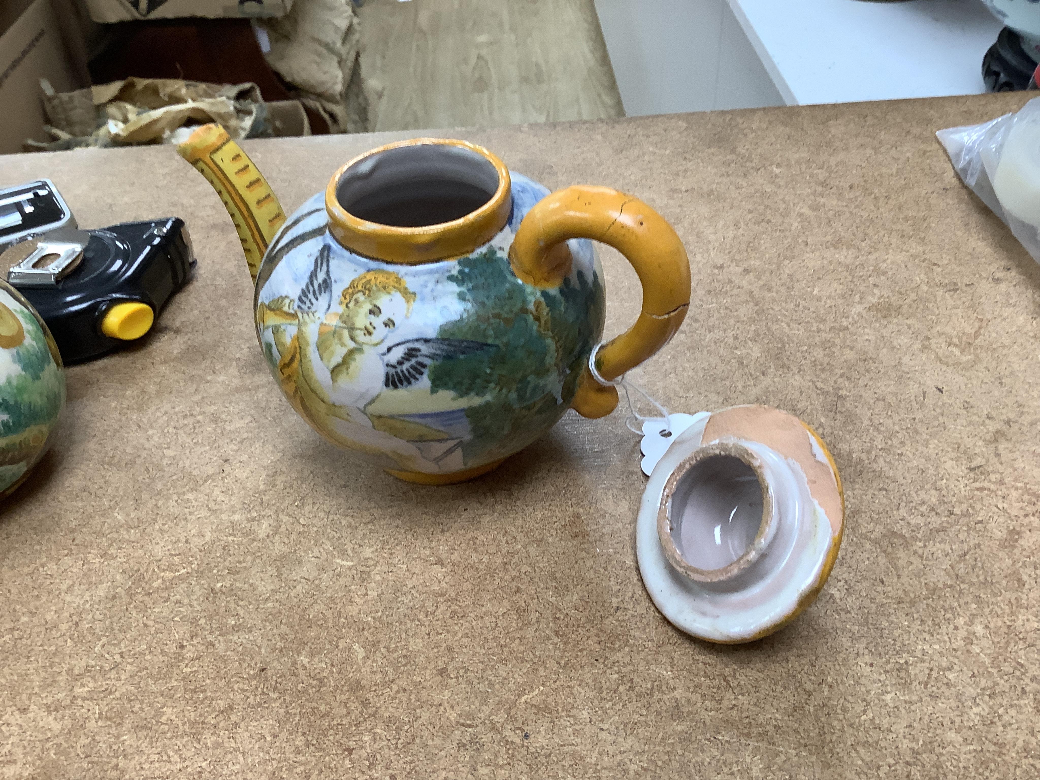 An Italian maiolica teapot and jug and a Talavera maiolica vase, 25cm high (3). Condition - jar good, teapot restored and cracked